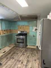 New plank floor down with the range back in place