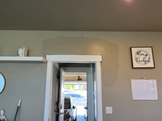 Room with a doorway through to the front of the house