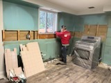 Kitchen being stripped back with materials stacked