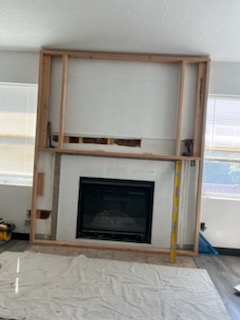 Fireplace framed out with the floor sheeted for protection