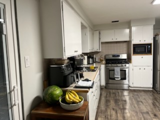 Wood-look plank flooring in an occupied kitchen