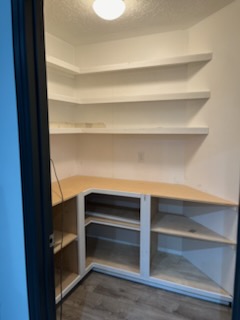 Corner shelving unit going in, shelves not yet finished