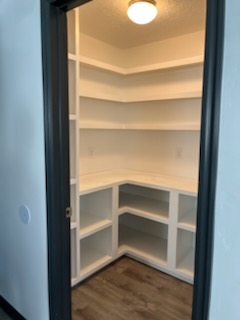 White pantry shelving built into a corner